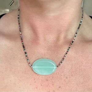 Elegant Beaded Necklace with Aqua Pendant